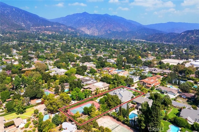 birds eye view of property featuring a mountain view