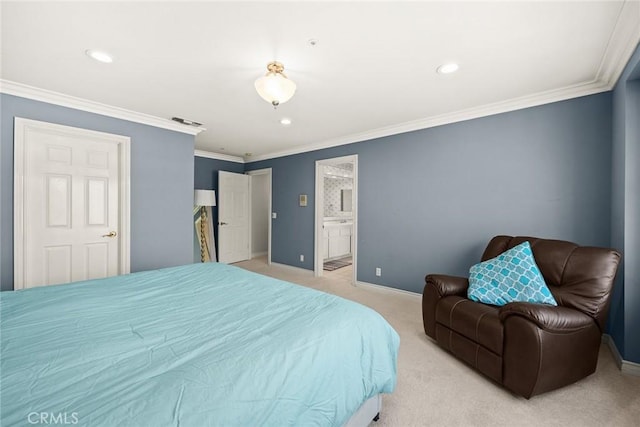 bedroom with ensuite bath, crown molding, and light colored carpet