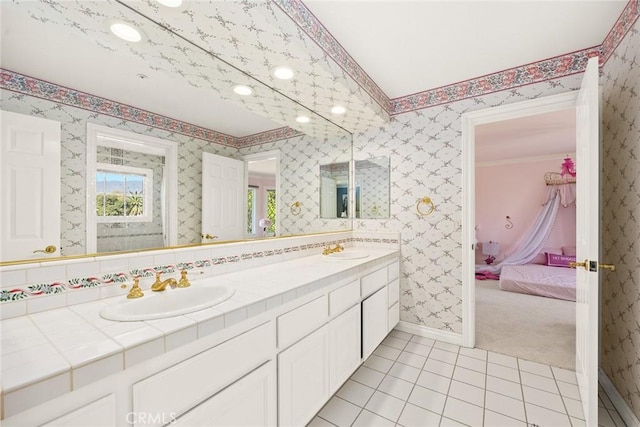 bathroom featuring tile patterned flooring and vanity