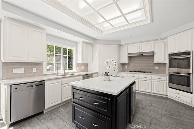 kitchen featuring a center island, white cabinets, and appliances with stainless steel finishes