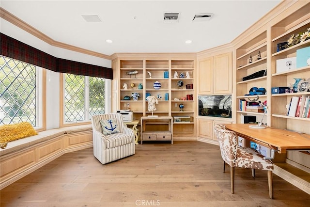 interior space featuring light hardwood / wood-style flooring and ornamental molding