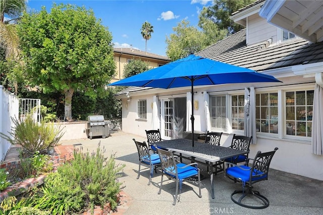 view of patio with a grill