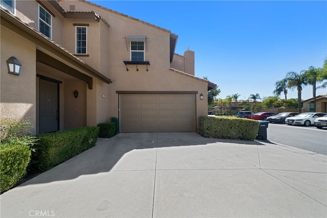 view of side of property with a garage