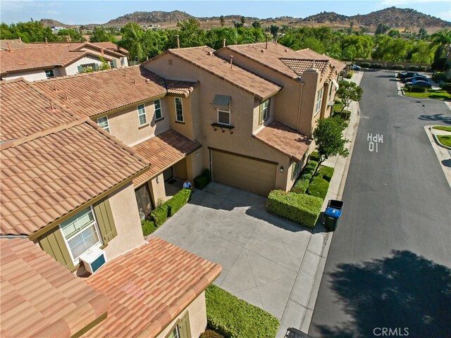 birds eye view of property featuring a mountain view