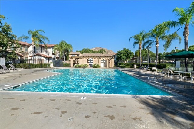 view of swimming pool with a patio area