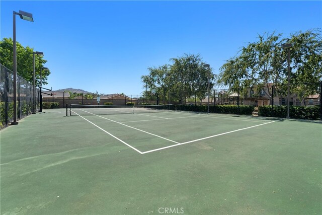 view of sport court with a mountain view