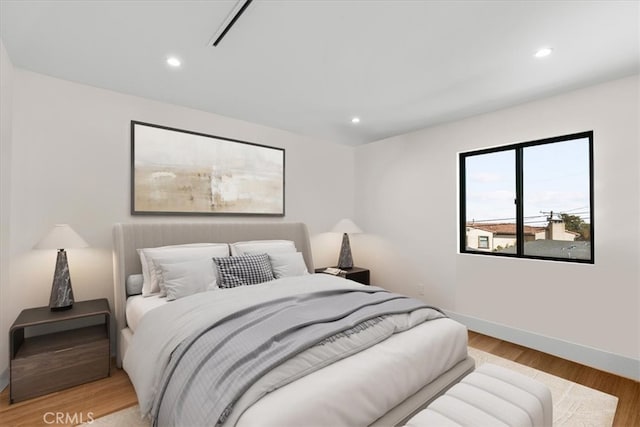 bedroom with light wood-type flooring