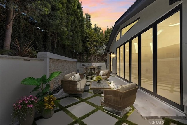 patio terrace at dusk with outdoor lounge area