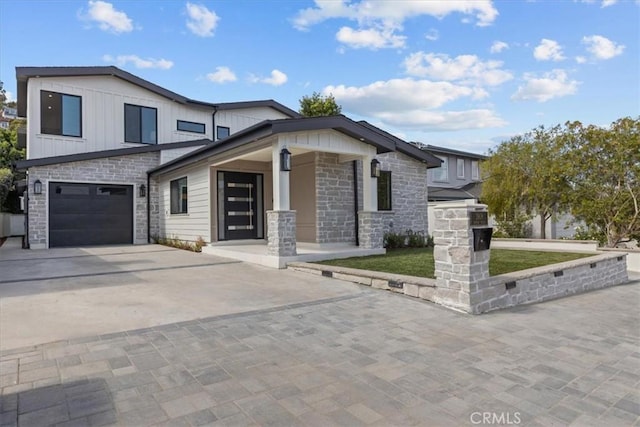 view of front of property with a garage and a porch