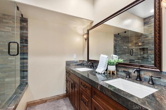 bathroom featuring walk in shower and vanity