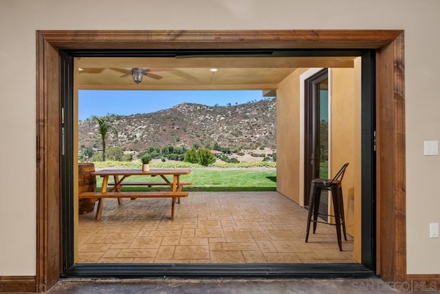 doorway to outside with plenty of natural light and a mountain view