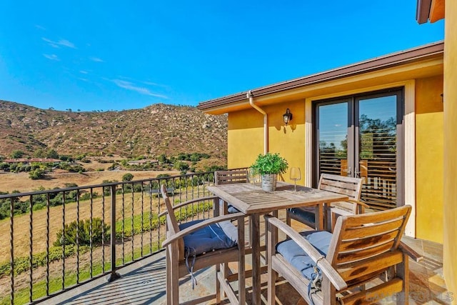 balcony featuring a mountain view