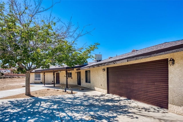 single story home featuring a patio