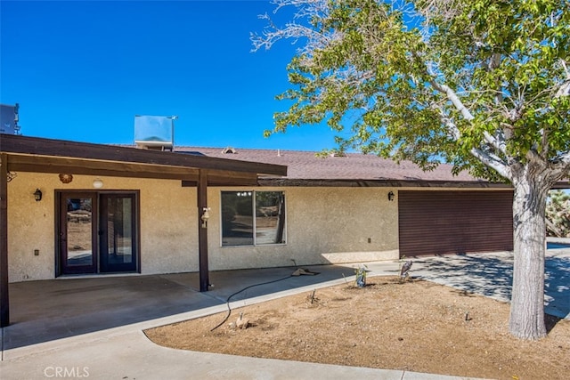 back of property featuring a patio