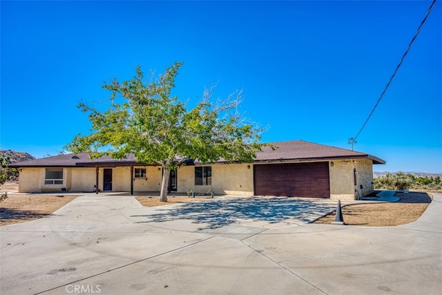 ranch-style home featuring a garage