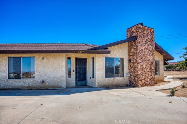 ranch-style house featuring a patio