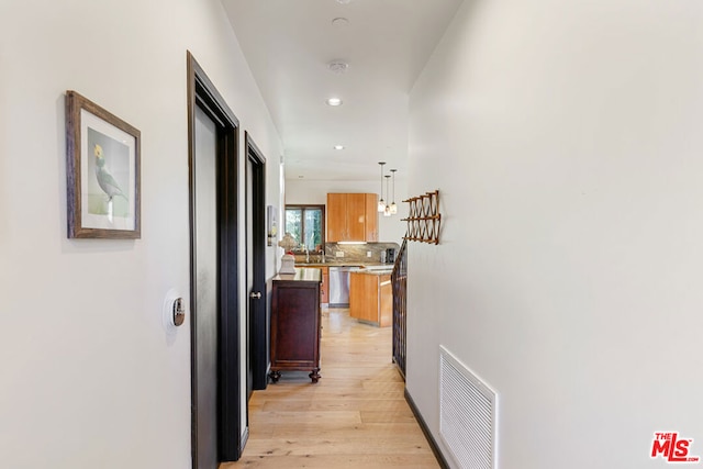 hallway featuring light hardwood / wood-style flooring