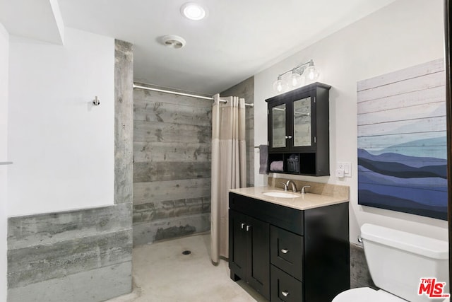 bathroom with toilet, vanity, curtained shower, and concrete flooring