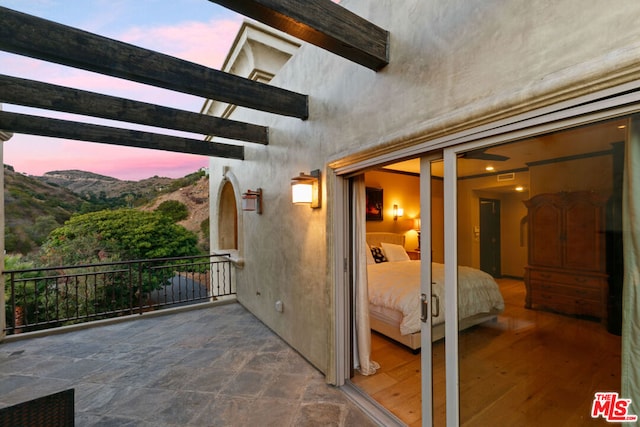 exterior space with a mountain view and a balcony