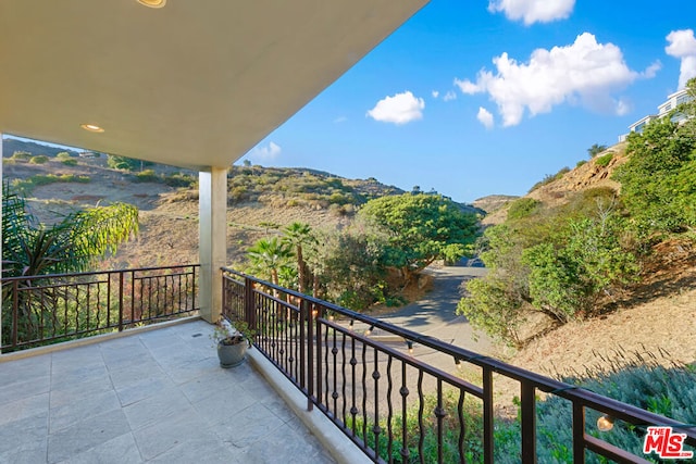 balcony featuring a mountain view