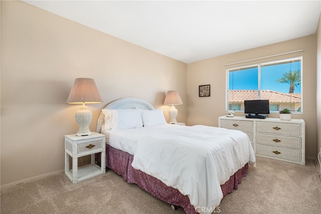 bedroom with light carpet