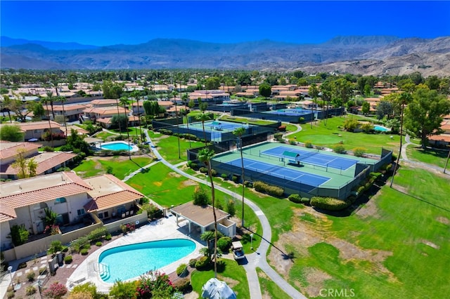 birds eye view of property featuring a mountain view