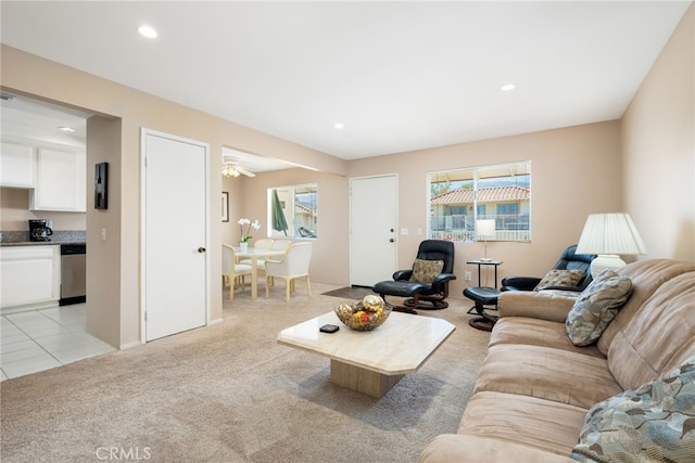 living room with ceiling fan and light carpet