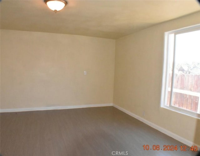 empty room with hardwood / wood-style floors