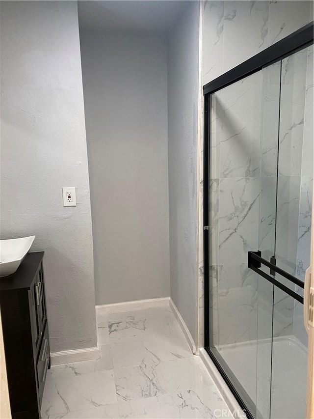 bathroom with vanity and walk in shower