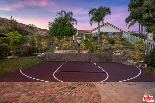 view of sport court with a mountain view