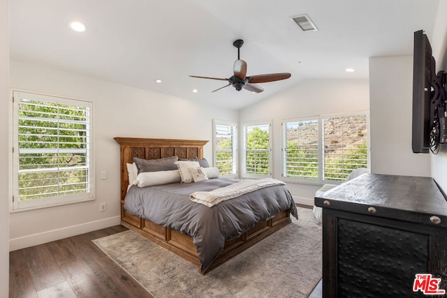 bedroom featuring ceiling fan, dark hardwood / wood-style flooring, and vaulted ceiling