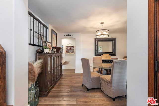 dining room with a chandelier and wood-type flooring