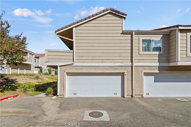 view of property exterior with a garage