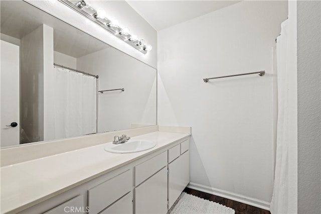 bathroom featuring wood-type flooring and vanity