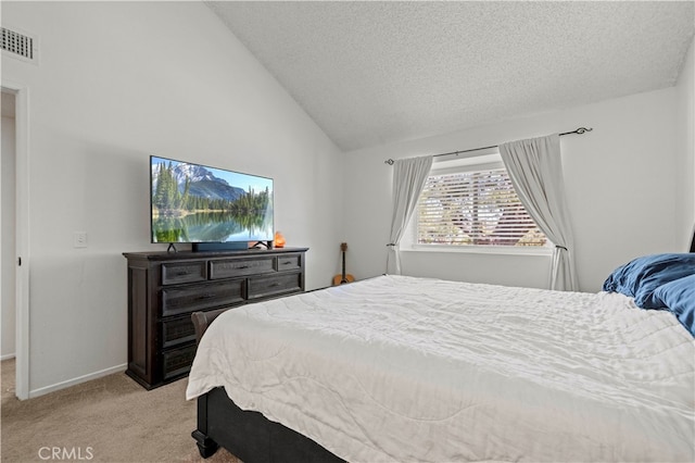 carpeted bedroom featuring vaulted ceiling and a textured ceiling