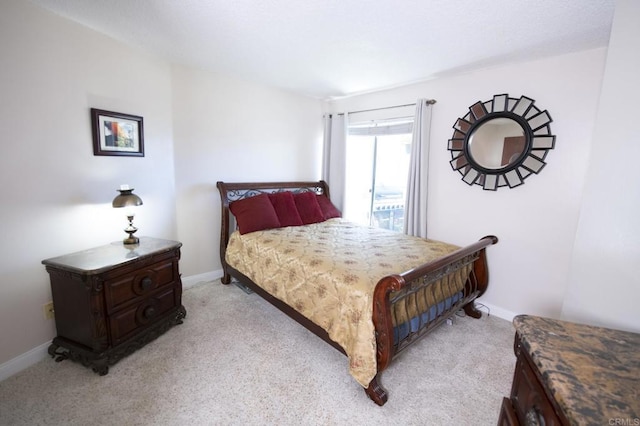 bedroom featuring light colored carpet