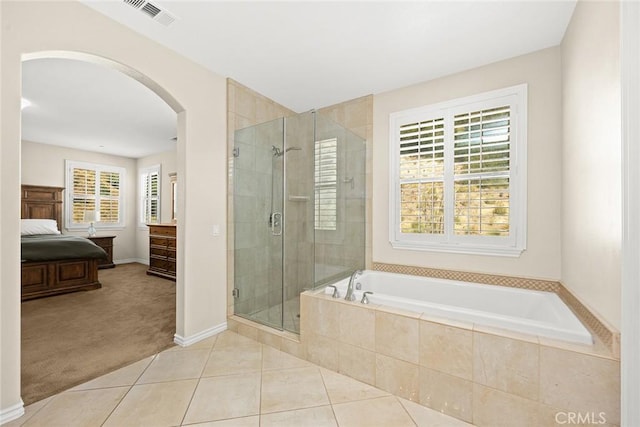 ensuite bathroom featuring tile patterned flooring, visible vents, a stall shower, ensuite bathroom, and a bath