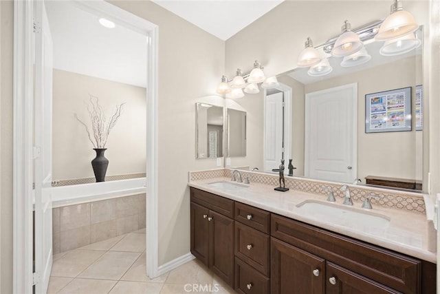 bathroom with a sink, double vanity, and tile patterned flooring