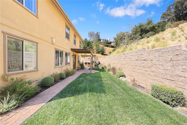 view of yard featuring a patio area, a fenced backyard, and a pergola