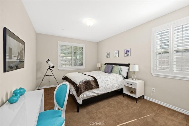 carpeted bedroom with baseboards