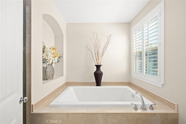 bathroom featuring a garden tub