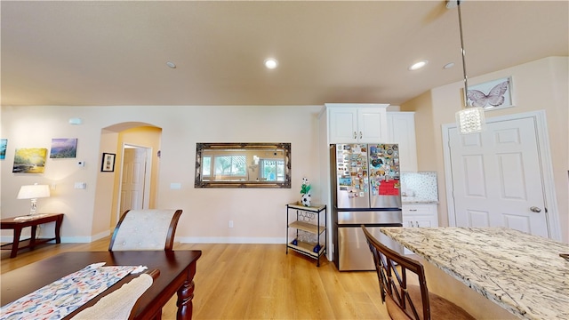 dining space featuring light hardwood / wood-style floors