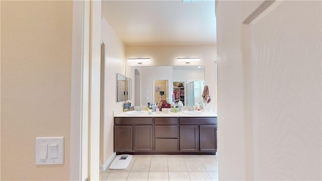 bathroom featuring tile patterned flooring and vanity