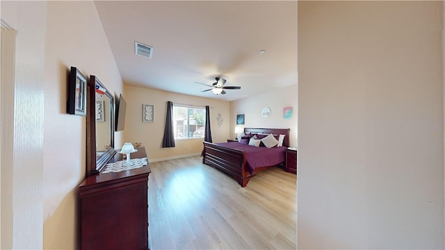 bedroom featuring ceiling fan and light hardwood / wood-style flooring