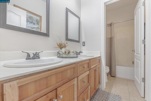 full bathroom with vanity, bathing tub / shower combination, toilet, and tile patterned flooring