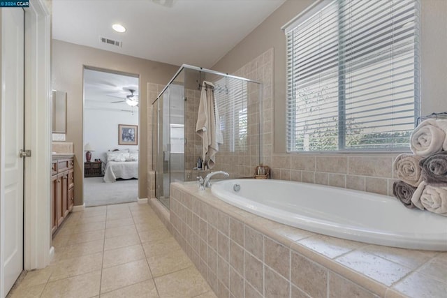 bathroom with independent shower and bath, vanity, ceiling fan, and tile patterned floors