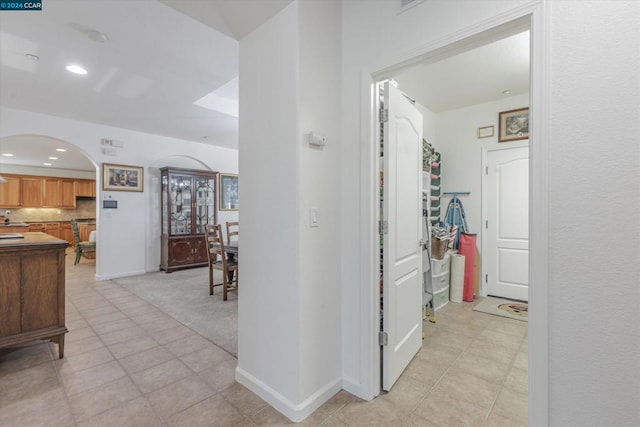 hall with light tile patterned flooring