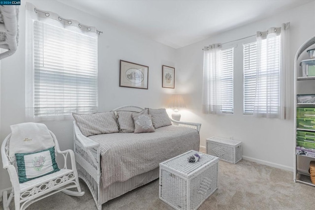 bedroom with light carpet