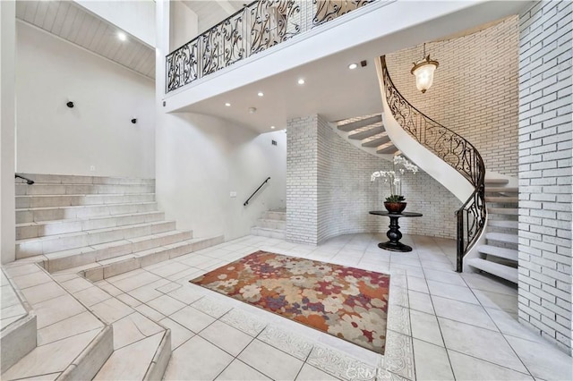 entrance foyer featuring a towering ceiling