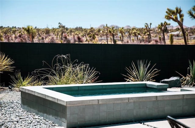 view of pool featuring a jacuzzi